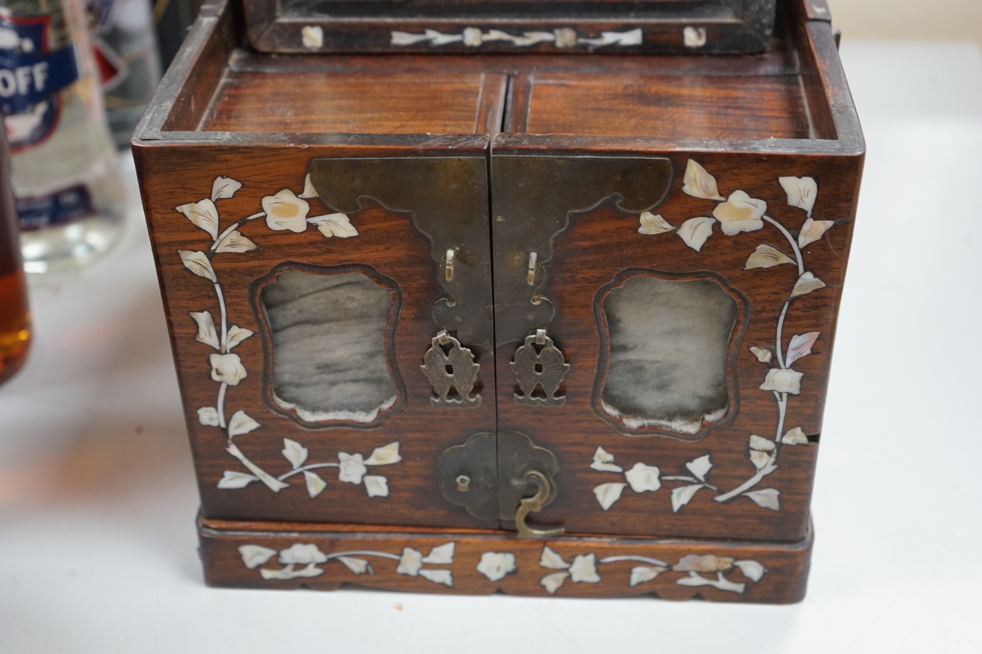 A Chinese mother of pearl inlaid hongmu jewellery box, c.1900, 30cm long